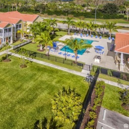 Resort-style swimming pool with lounge seating